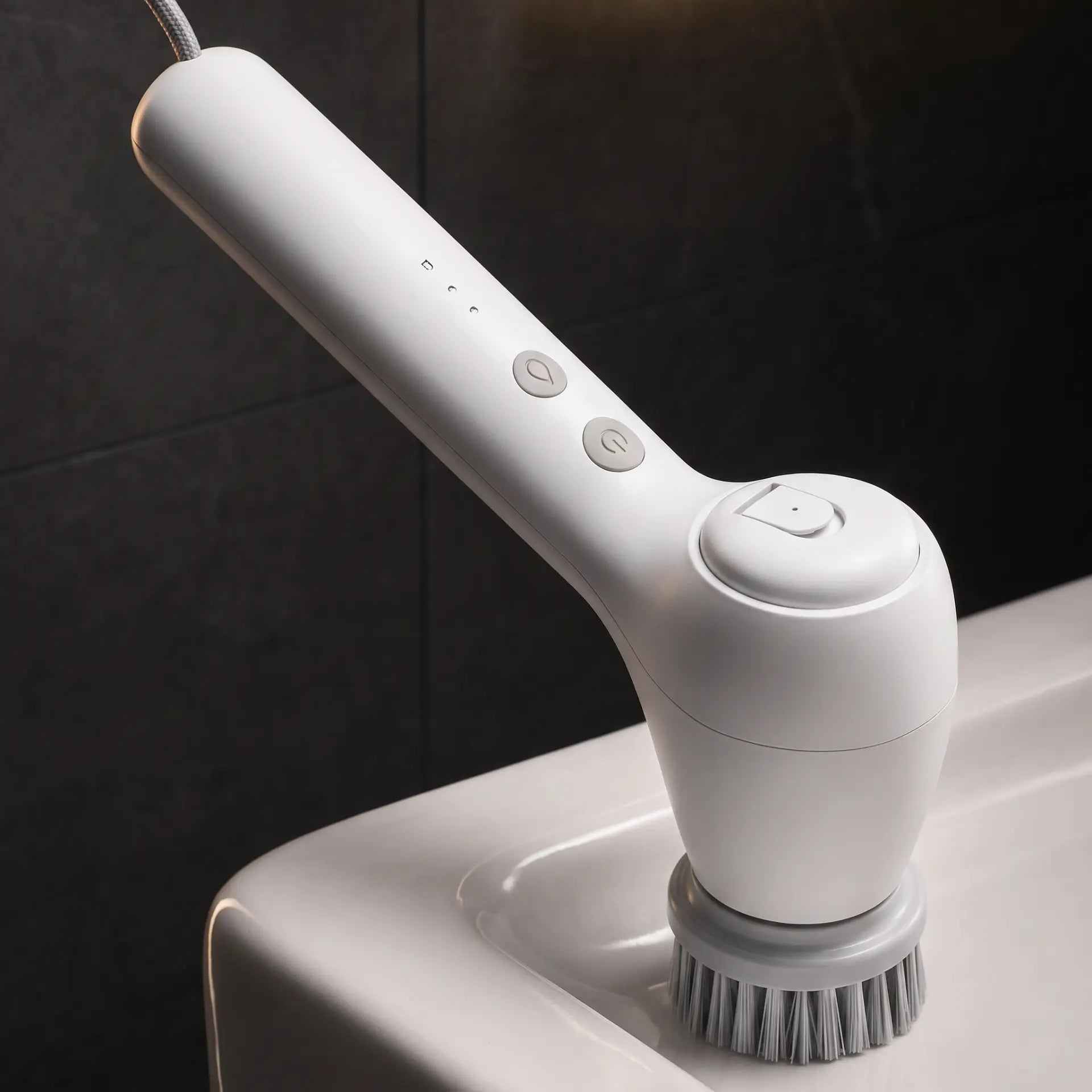 GravN Spin Scrubber resting on a bathtub edge